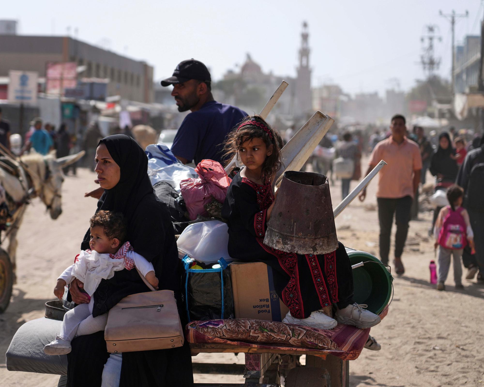 Palestinians evacuate Khan Younis on Monday after Israel declared the city centre as a ‘combat zone’. Photograph: Abdel Kareem Hana/AP