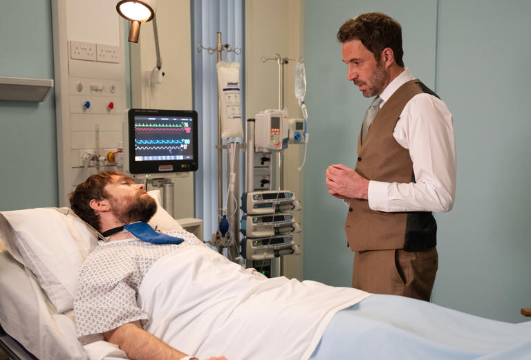 Suited and booted and set to marry Aaron, John sneaks off to visit his ex, Aidan, fearful of what he might say (Image credit: ITV)