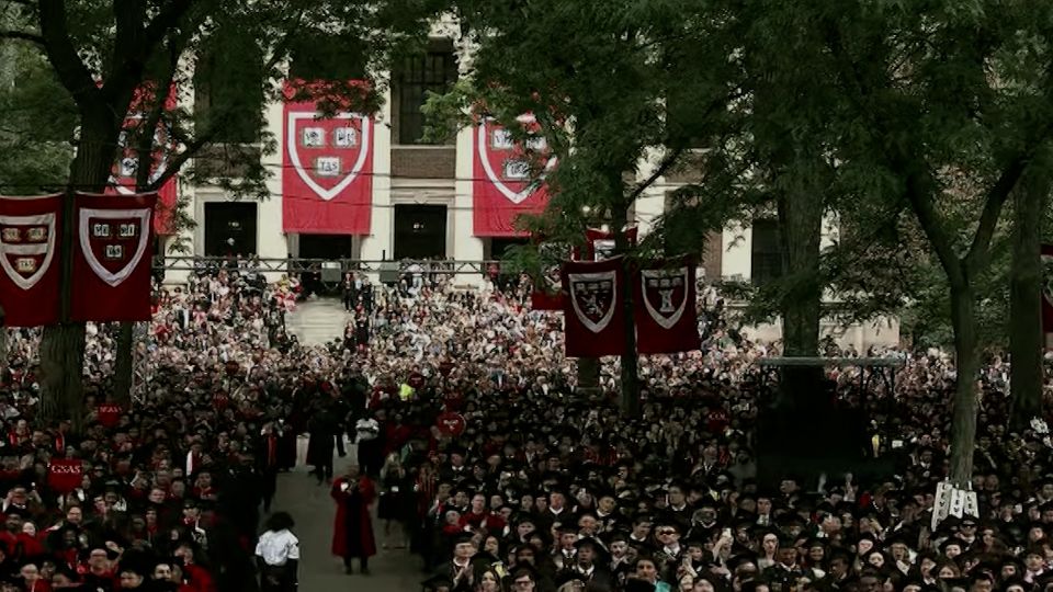 See standing ovation for Harvard president at commencement
