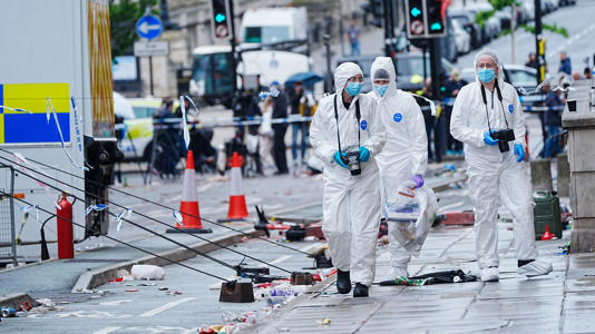 Forensic officers at the scene in Water Street. Pic: PA