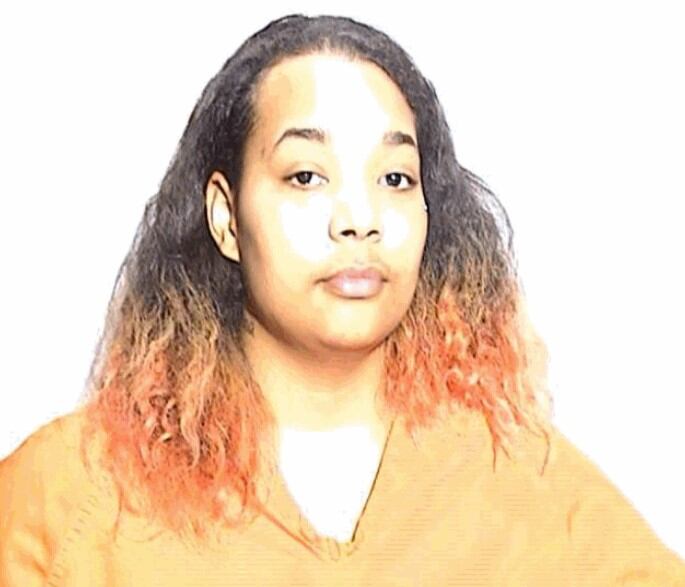 Woman accused of stabbing victim in the back