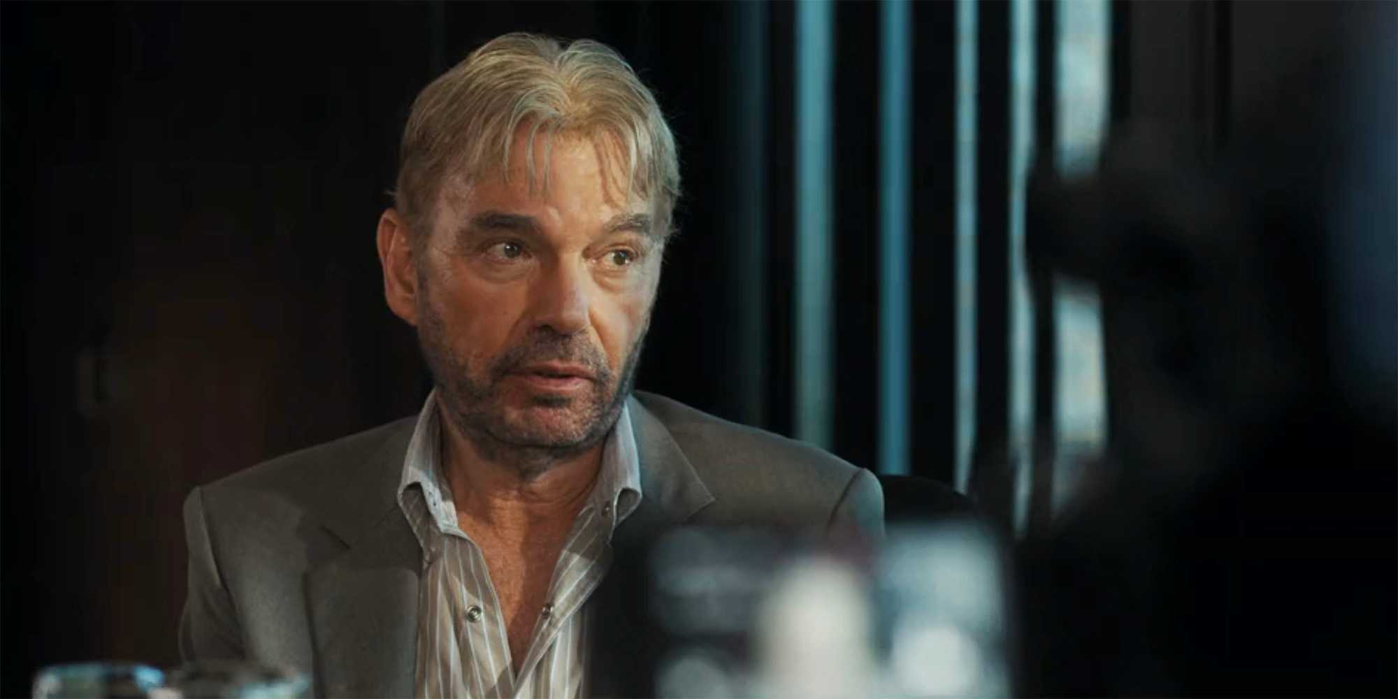 Tommy looks out the window during his deposition