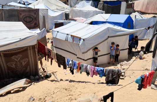 Displaced Palestinian children take shelter in tents, in Khan Yunis, in the southern Gaza Strip, May 29, 2025. (photo credit: REUTERS/Hatem Khaled)