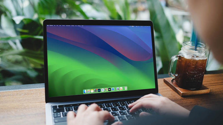 A person using a MacBook Pro.