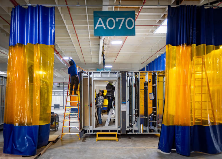 A SoLa Impact modular housing unit is assembled at a Los Angeles factory.