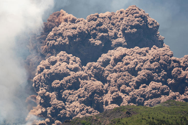 Plumes of ash and volcanic steam rise from Mount Etna, as seen from Milo, Italy (Reuters)