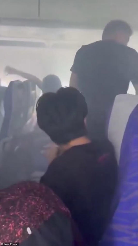 Video footage showed passengers panicking as thick, acrid smoke began billowing out of an overhead locker