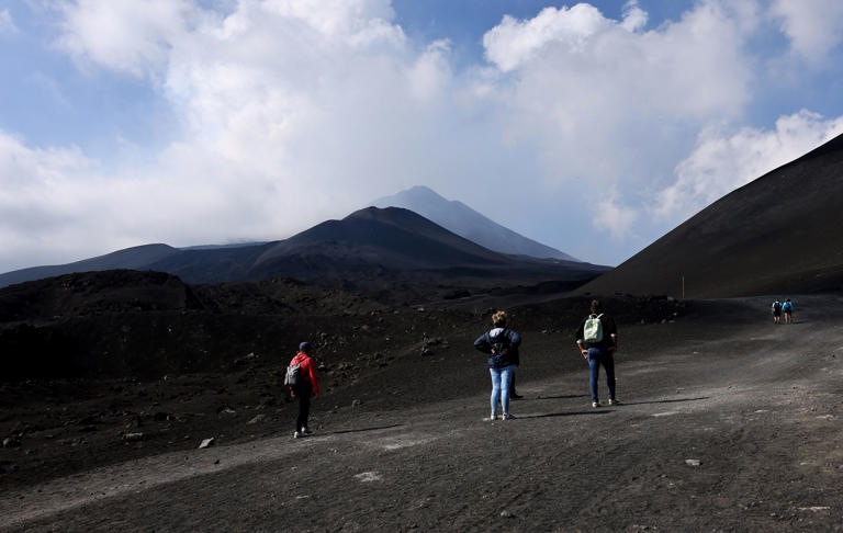 Tourists tour Mount Etna after its eruption on Monday morning (REUTERS)