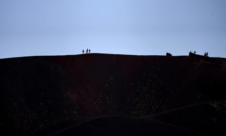 Tourists continued to tour the volcano following its eruption (REUTERS)