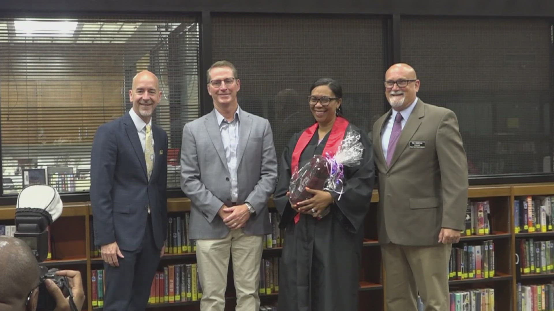 White Hall High celebrates school secretary earning degree