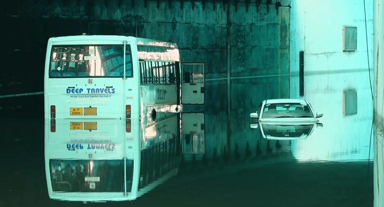Vehicles partially submerged following at the Delhi Cantt underpass