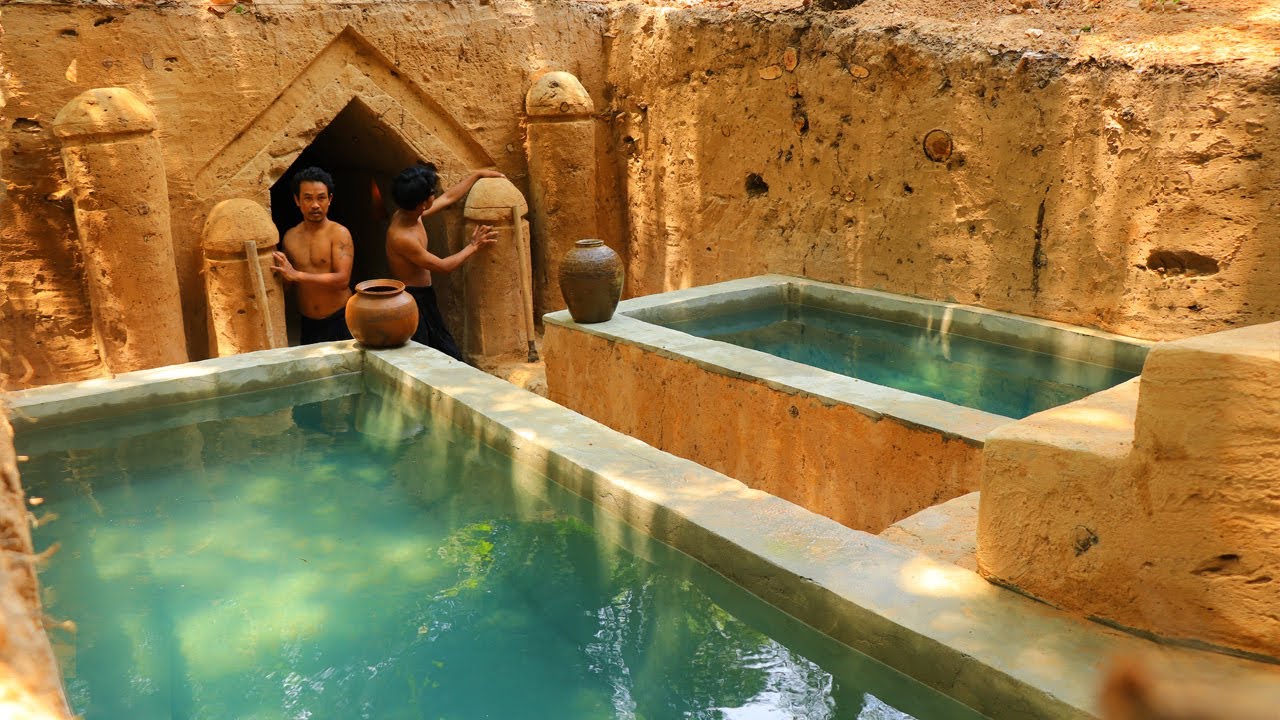 Builders dig an underground house with twin pools using primitive tools