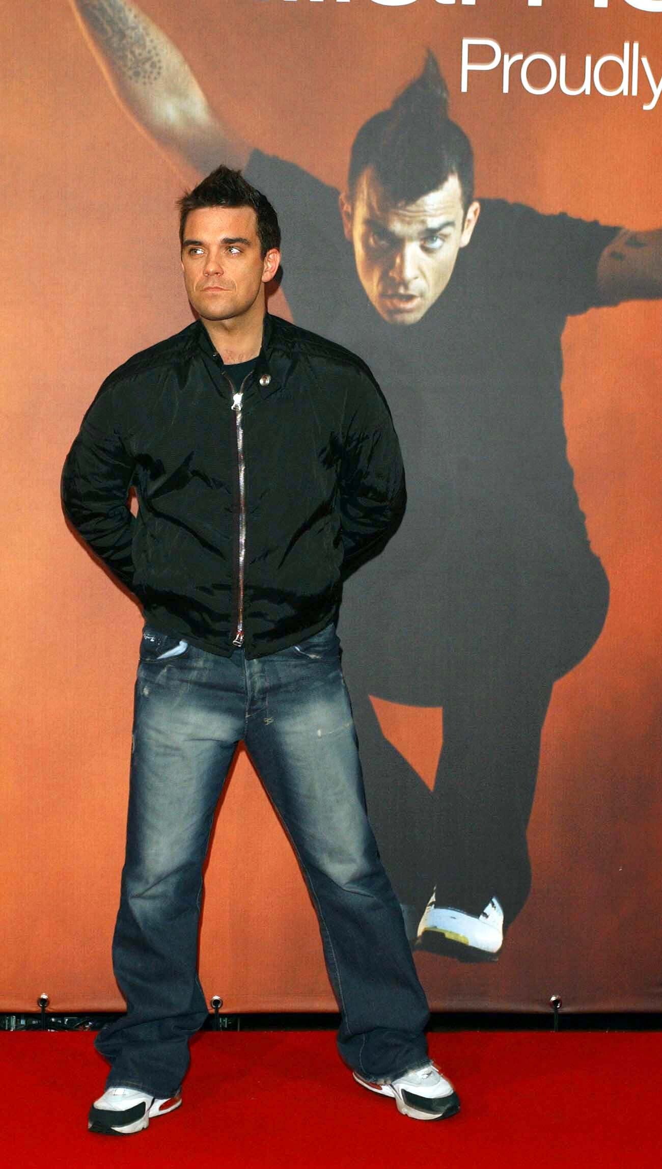 Robbie Williams’ style was quintessential of early 2000s men’s fashion (Kim Myung Jung/PA)