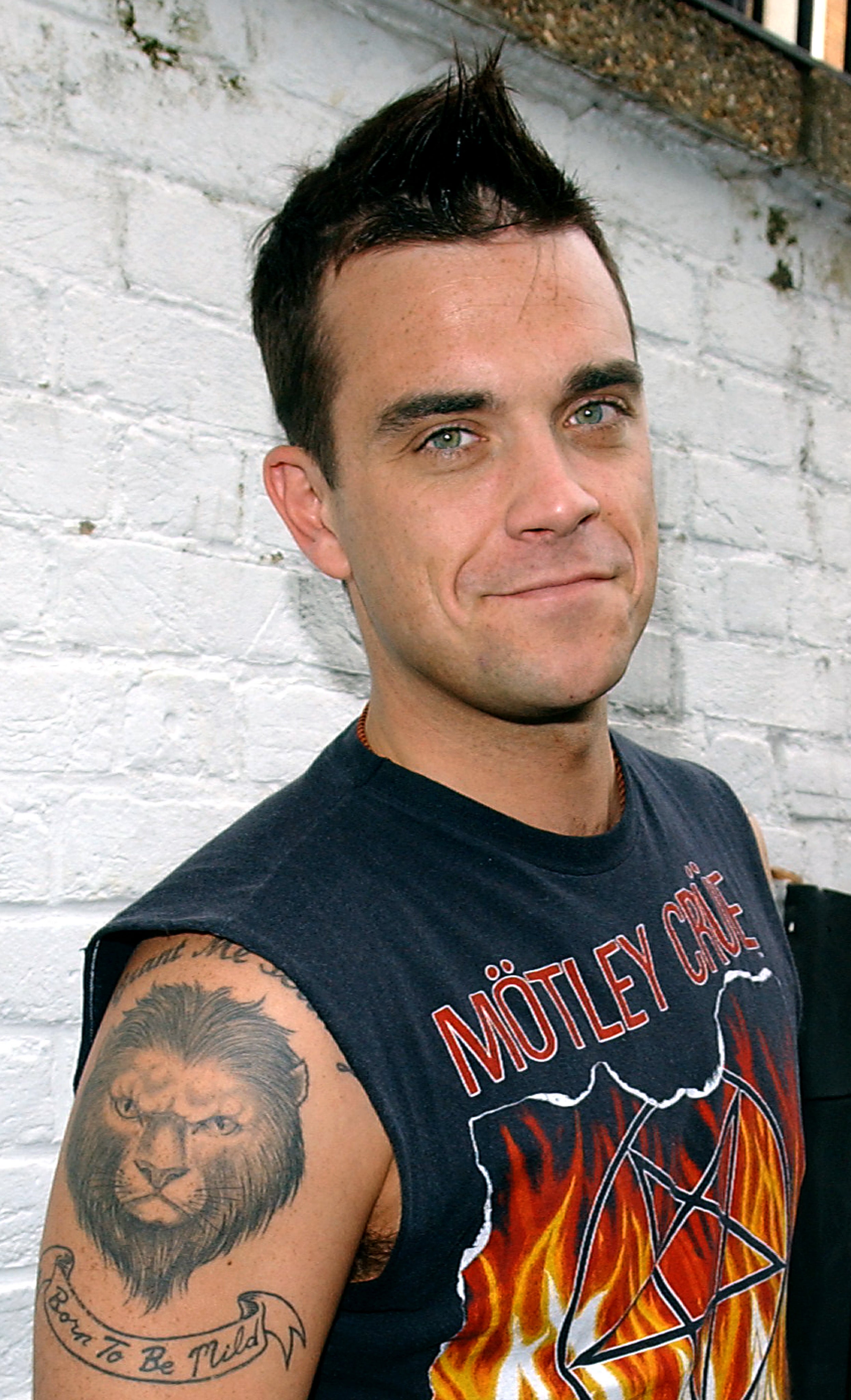 Robbie Williams’ lion tattoo is accompanied with the words ‘Born To Be Mild’ (Ian West/PA)
