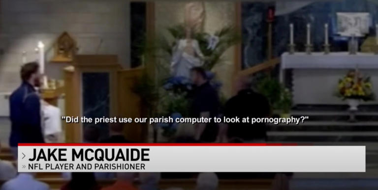 McQuaide stood to ask questions in a contentious scene at the church. Local 12 via Facebook/Our Lady of the Visitation
