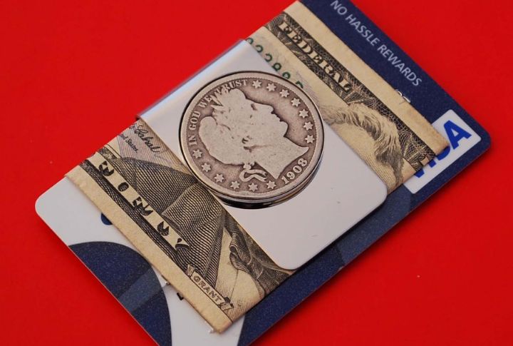 A close-up of a vintage baseball card peeking out from a protective grading slab, highlighting the card's pristine condition and the slab's precise dimensions.