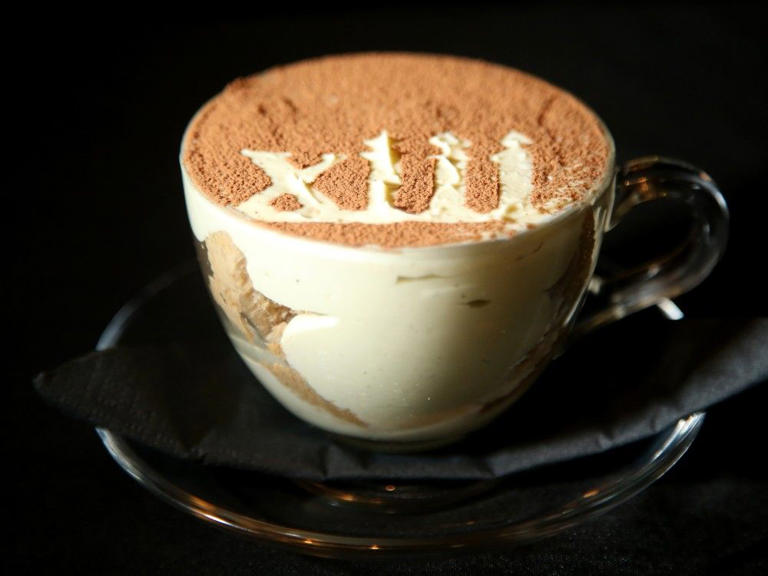  Tiramisu with pistachio cream, espresso, and ladyfingers, topped with 13 (Tredici in Italian) dusted onto the top.