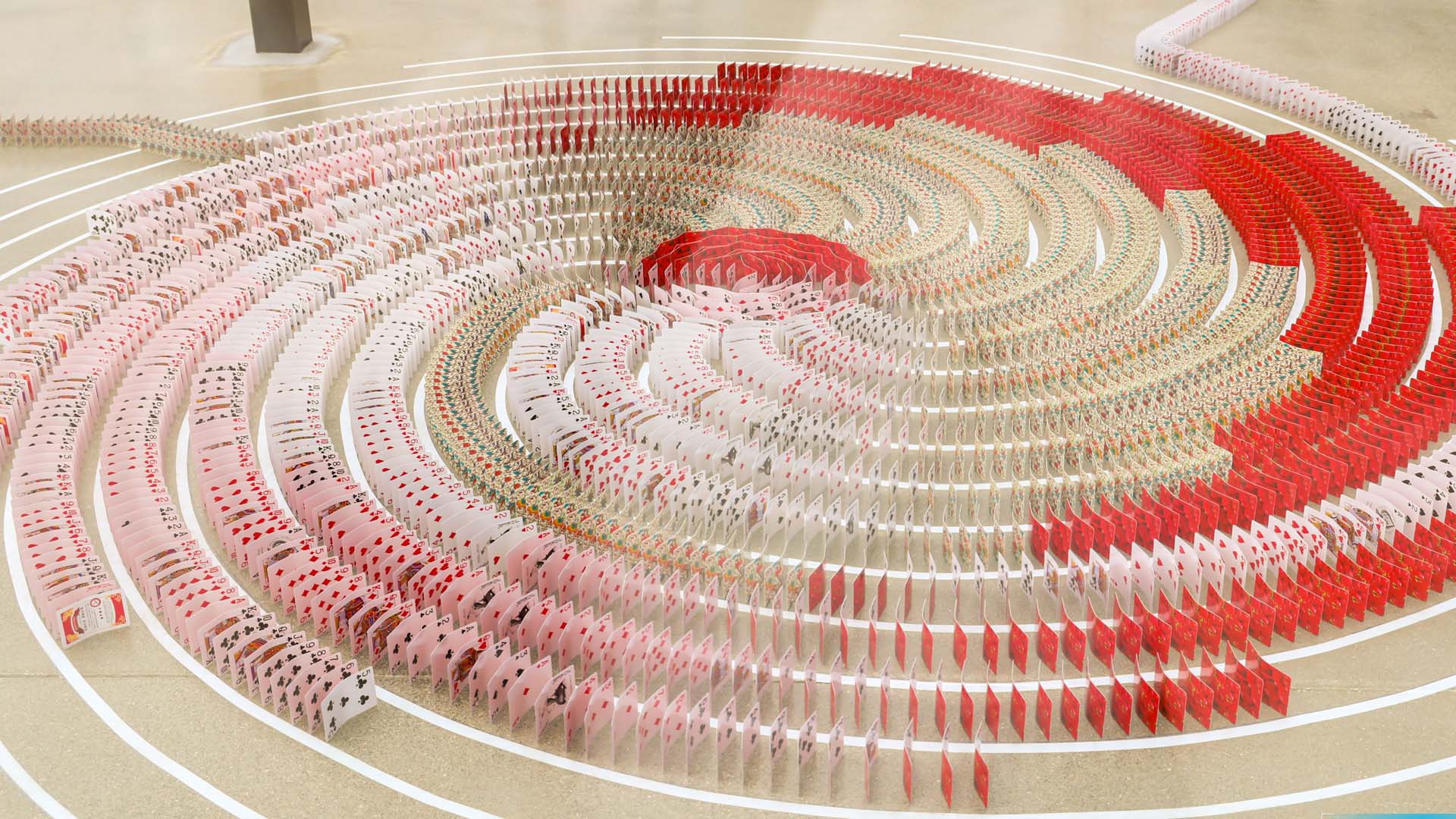 New Guinness World Records title set by toppling 51,725 playing cards ...