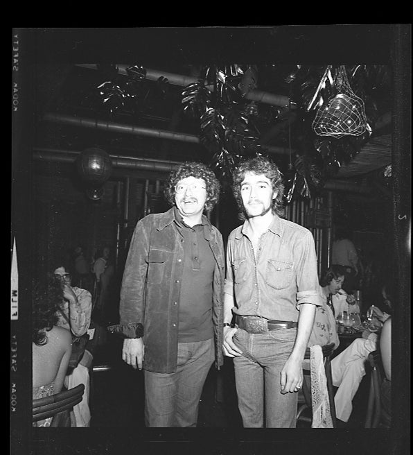 The author's father with Tom Moncrieff, the drummer for Stevie and Lindsey, at the concert after-party Richard Dingler threw for the duo at The Luau in Birmingham.