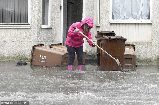 Residents struggle to stop flooding in their homes and businesses in Devon this week