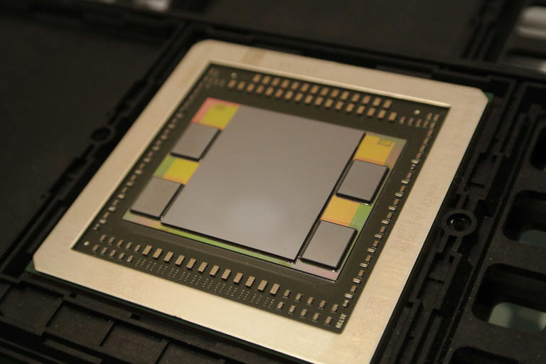 Close-up of an AMD GPU die along with HBM memory and substrate