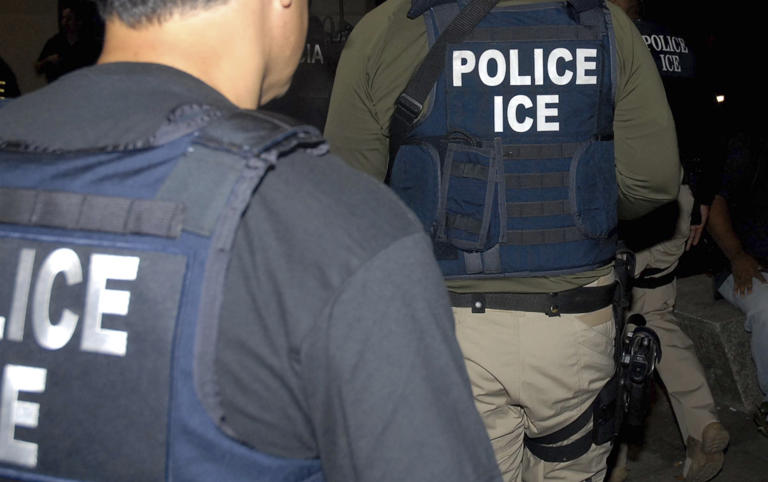 File photo shows ICE agent. AP