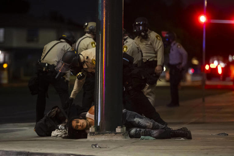 Nearly 100 arrested in downtown Las Vegas ICE protest, police say