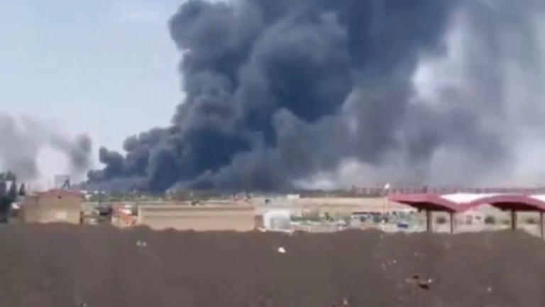 In this screengrab from social media, smoke is seen rising from Tabriz airport in Iran on June 13, 2025, following Israeli strikes. - Reuters