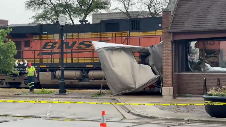 Video shows collision between semitruck, freight train at suburban rail ...