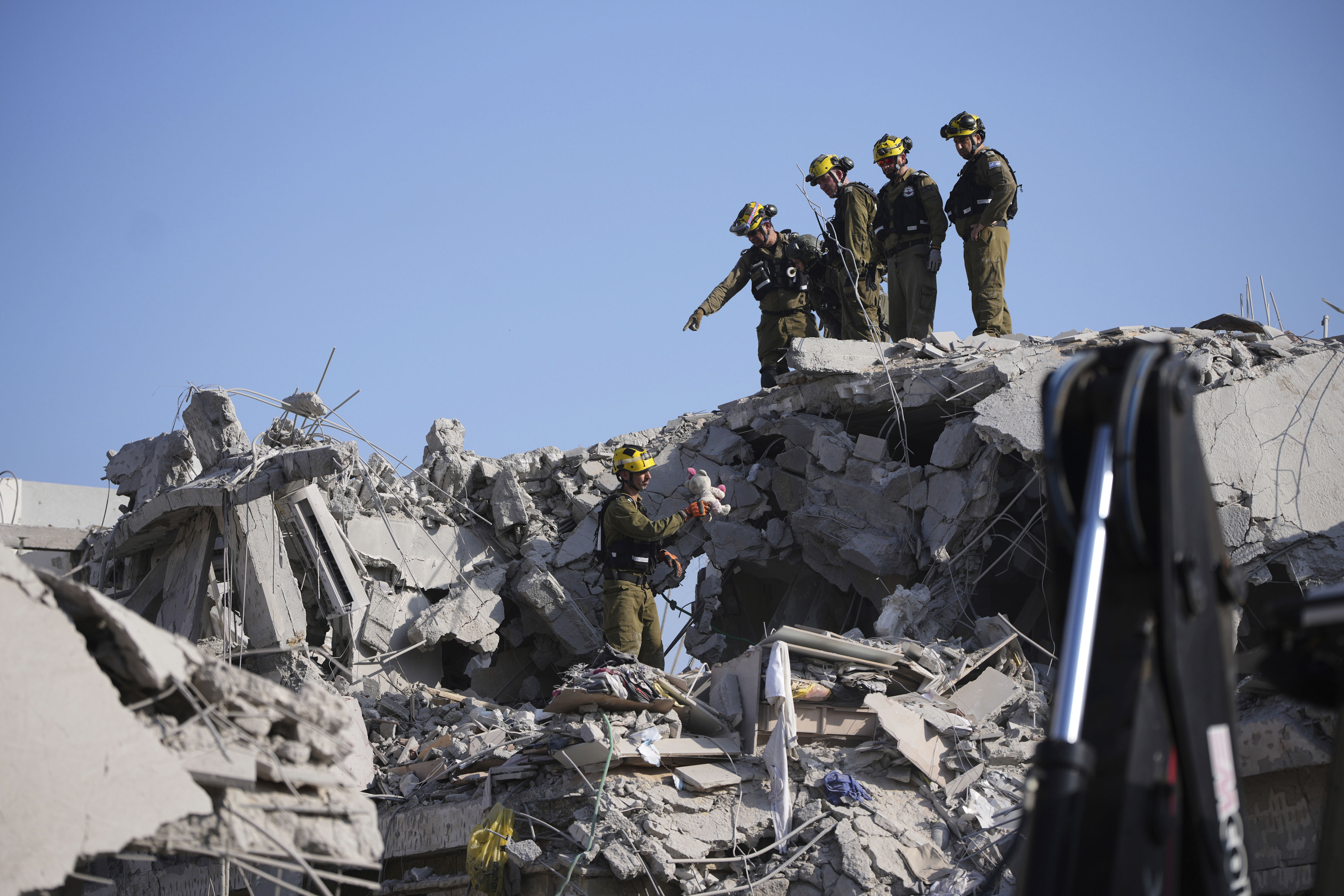 Israel says Tehran will burn amid dueling missile launches with Iran