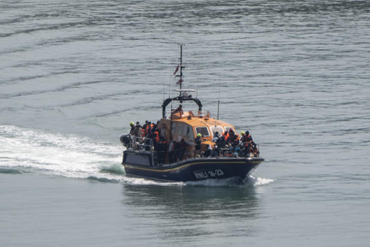 A group of people thought to be migrants are brought in to Dover on Friday, June 13 (Gareth Fuller/PA Wire)