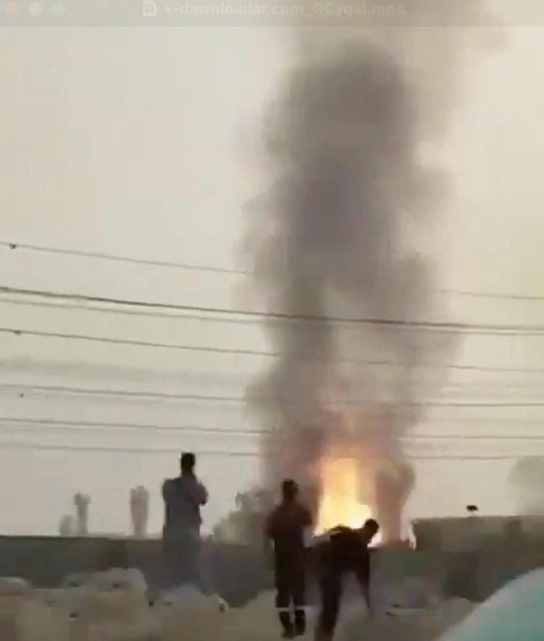 People look at fire burning at South Pars gas field, in Tonbak, Bushehr Province, Iran, in this screen grab from a handout video released on June 14, 2025.