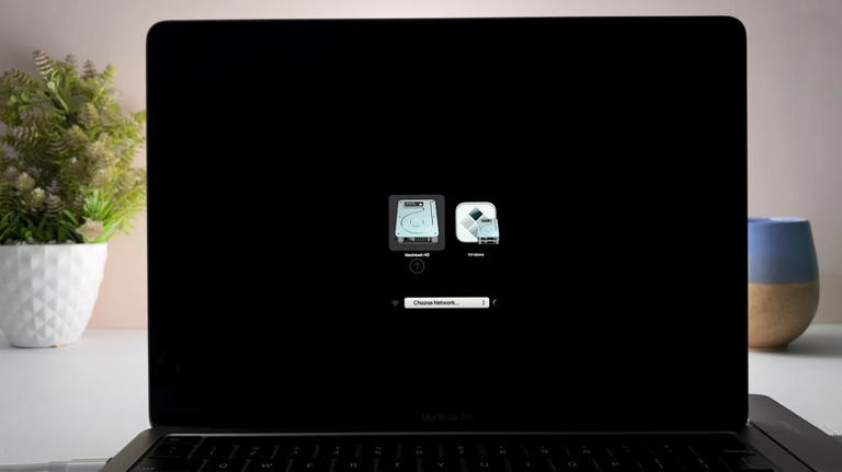 MacBook on a desk showing dual boot menu.png