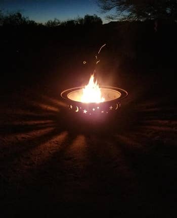 the cosmic themed firepit at night