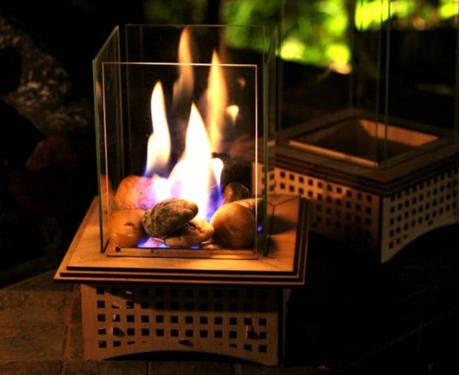 a mini tabletop glass fireplace
