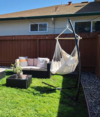 the same chair hung in a backyard