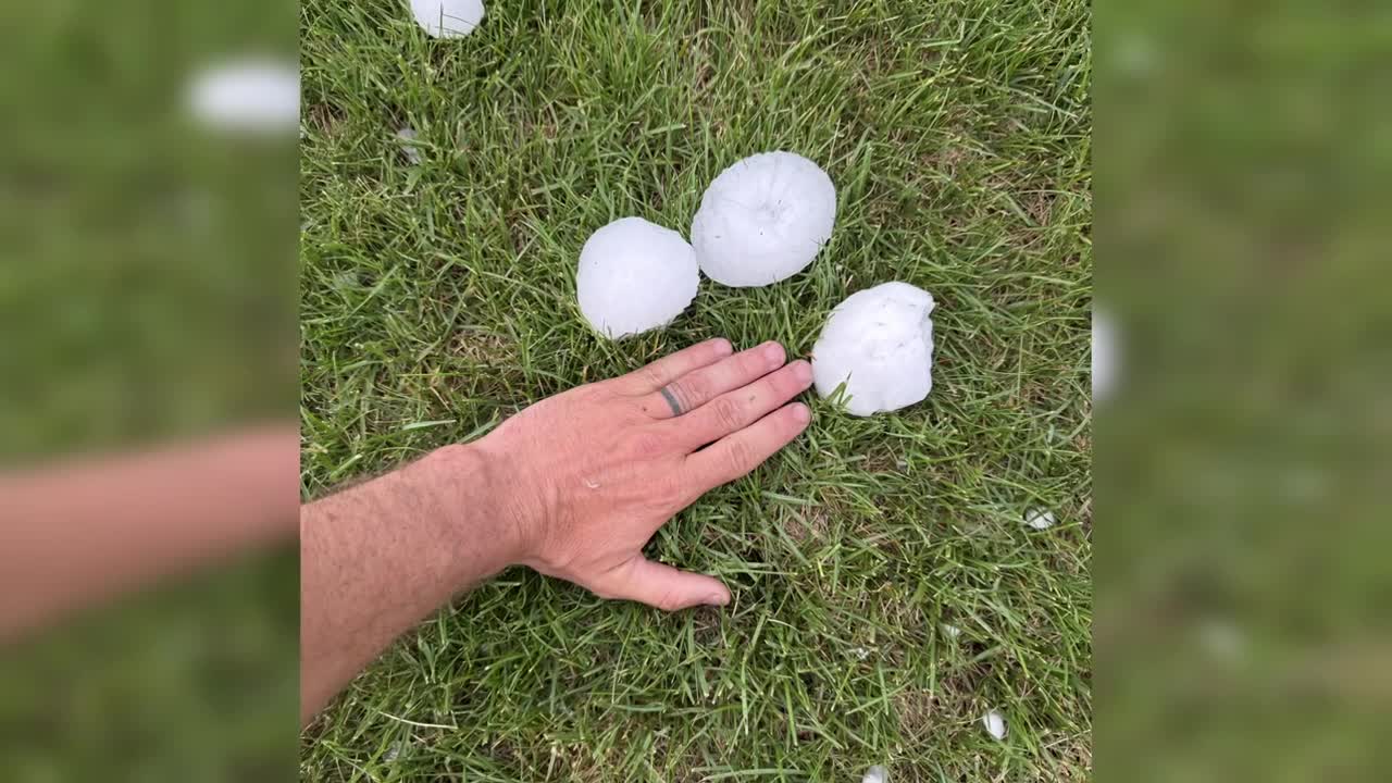residents picking up after tennis ball sized hail hits the(02)
