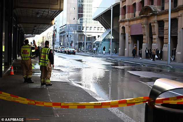 Chaos as burst water main shuts down Sydney's busiest court and plunges ...