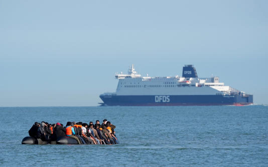 A group of people thought to be migrants on a dinghy off the beach at Gravelines, northern France, on Tuesday - Gareth Fuller/PA Wire