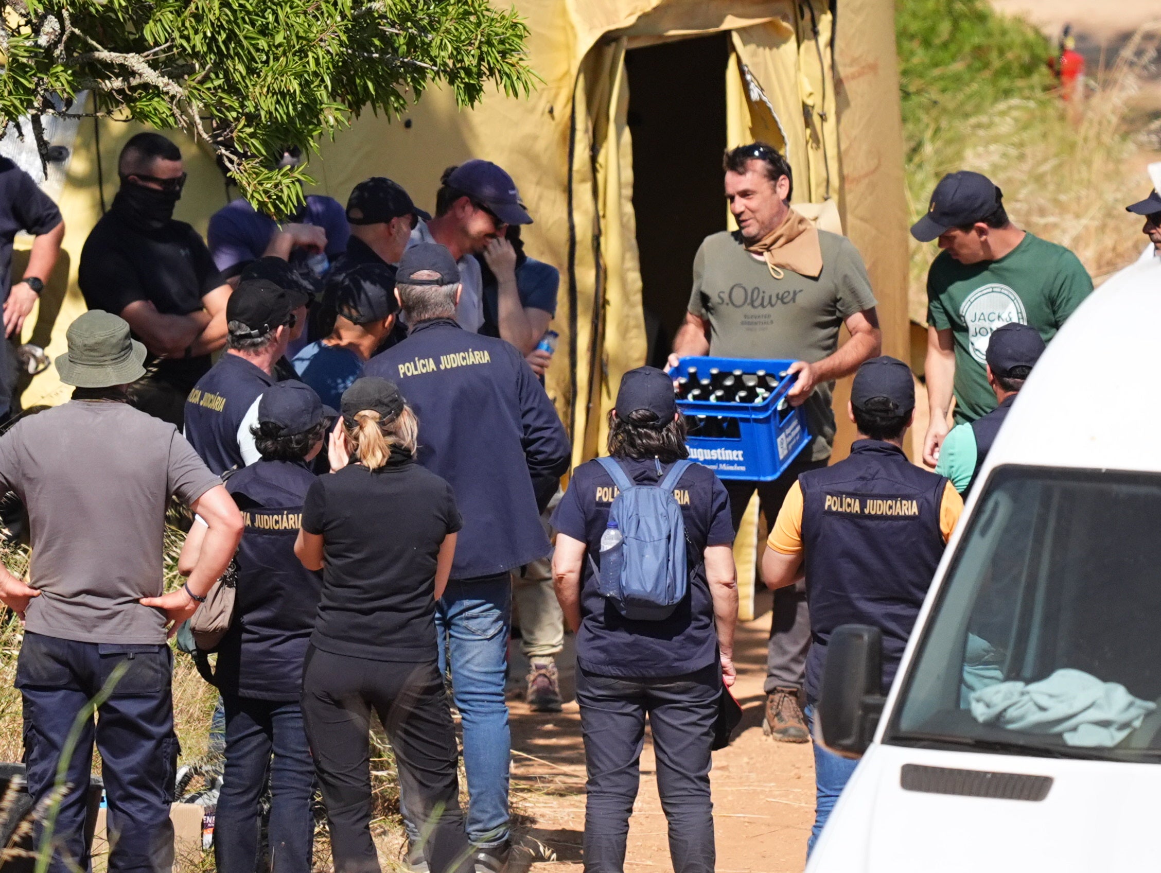 A crate of drink is produced by members of the search teams as the search appeared to come to an end on Thursday (PA)