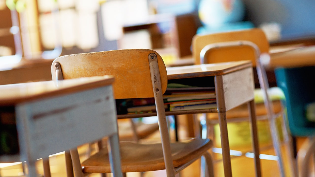 A traditional classroom with desks.