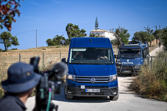 A van of German Investigation Police leaves the search operations (AFP via Getty Images)