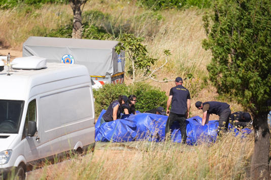 Officers pack up a tent at the end of the day (James Manning/PA Wire)