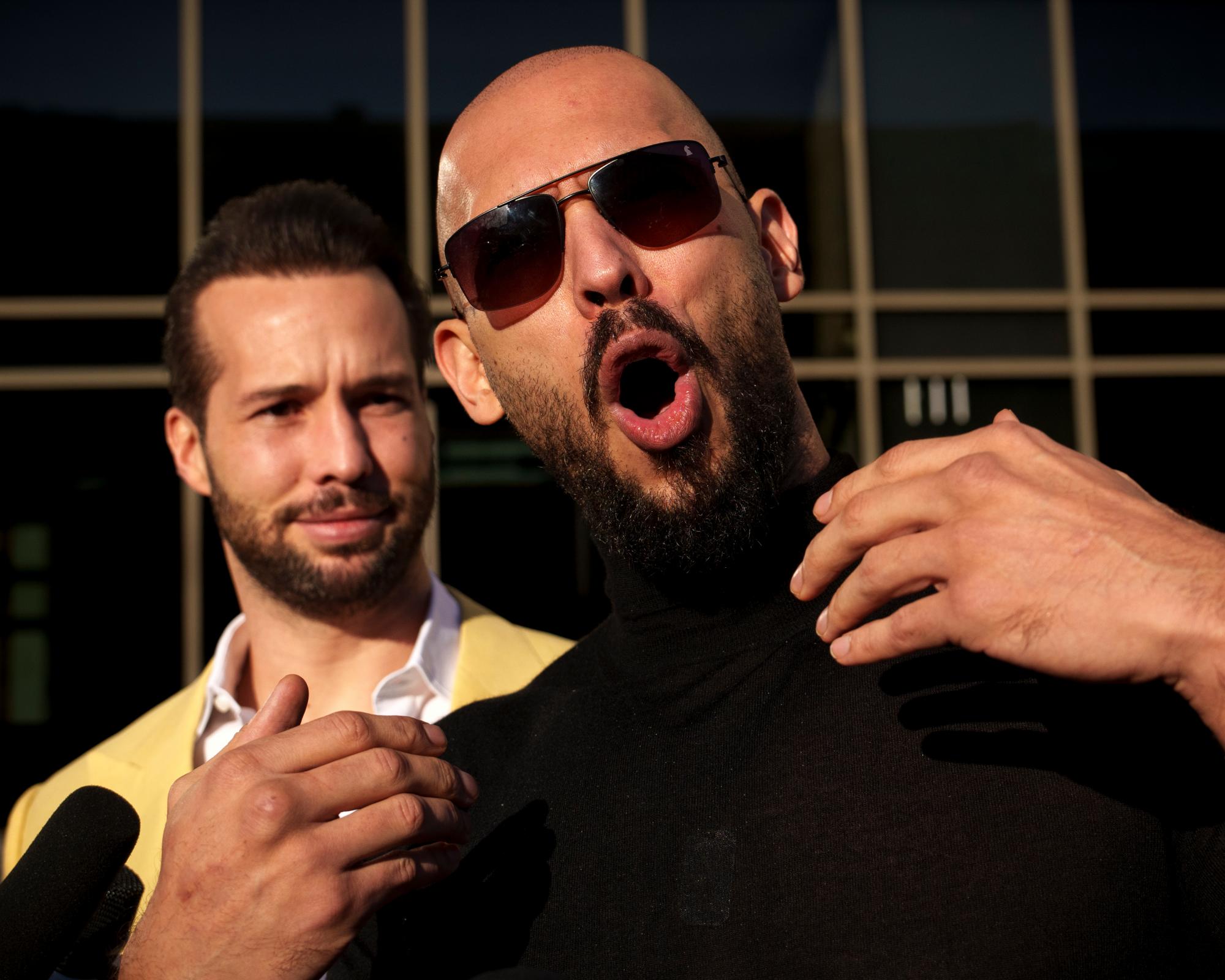 Andrew Tate pictured with his brother, Tristan, outside a tribunal in Romania in January. Photograph: Vadim Ghirdă/AP