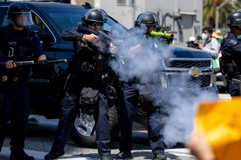 LA riot police shoot protester in the head with rubber bullet