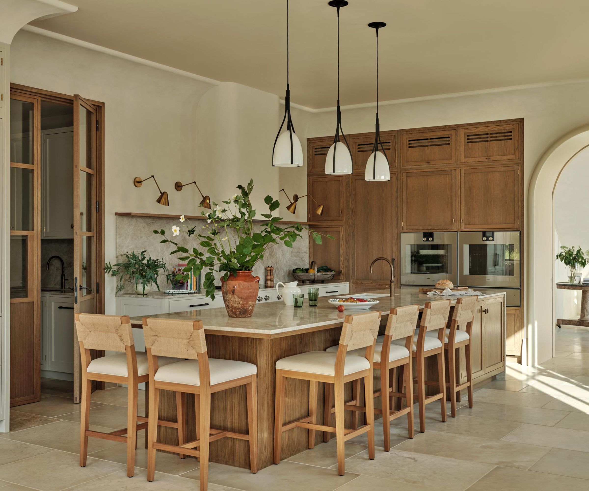 Rustic wood and wood kitchen with a large kitchen island with seating