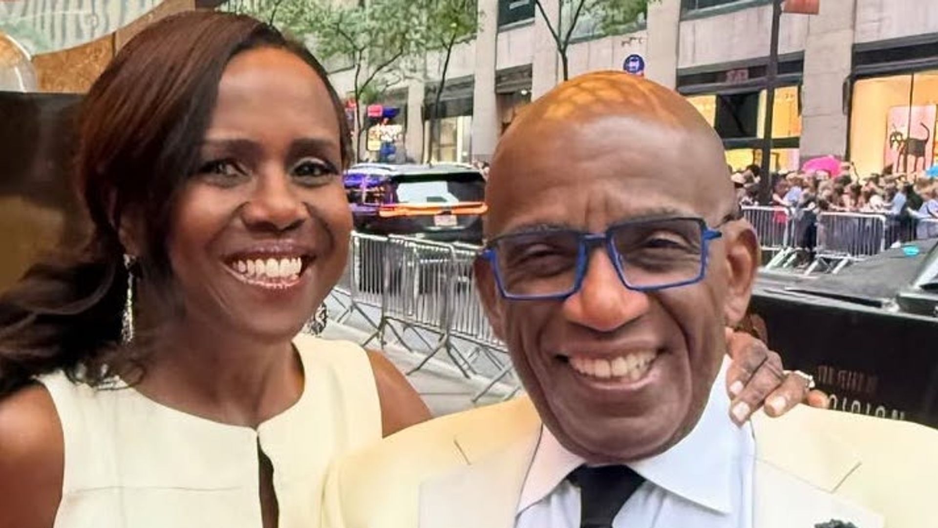 Al and Deborah smiling matching outfits