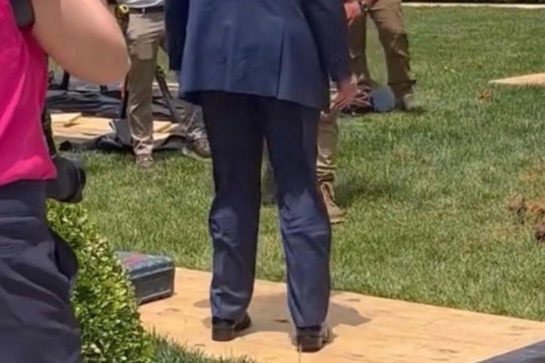 The president appeared to have something attached to his leg
