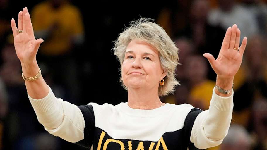Former Iowa women’s basketball head coach Lisa Bluder, waves to the crowd during a recognition ceremony at halftime of the Iowa Hawkeyes game against the Maryland Terrapins Sunday, Jan. 5, 2025 at Carver-Hawkeye Arena in Iowa City, Iowa. | Julia Hansen/Iowa City Press-Citizen / USA TODAY NETWORK via Imagn Images