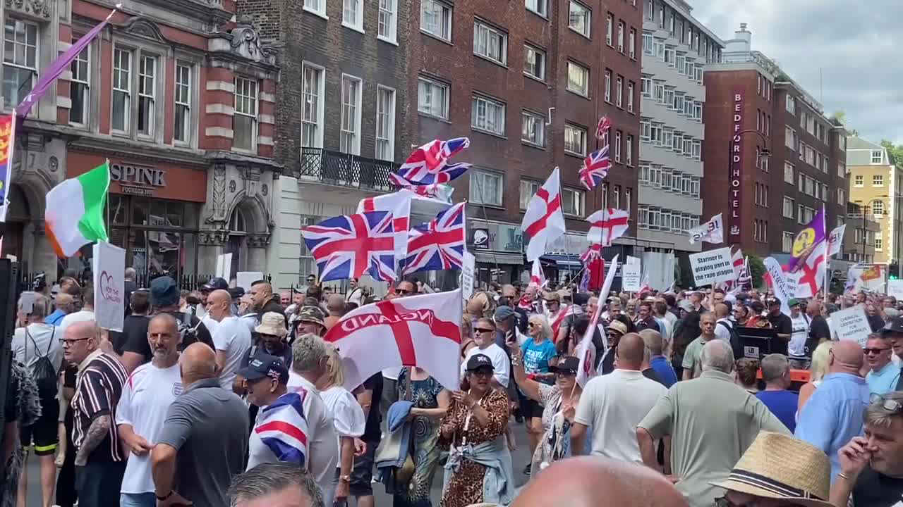 Right wing protesters throw a smoke bomb and chant at a person Right wing protesters throw a smoke bomb and chant at a person